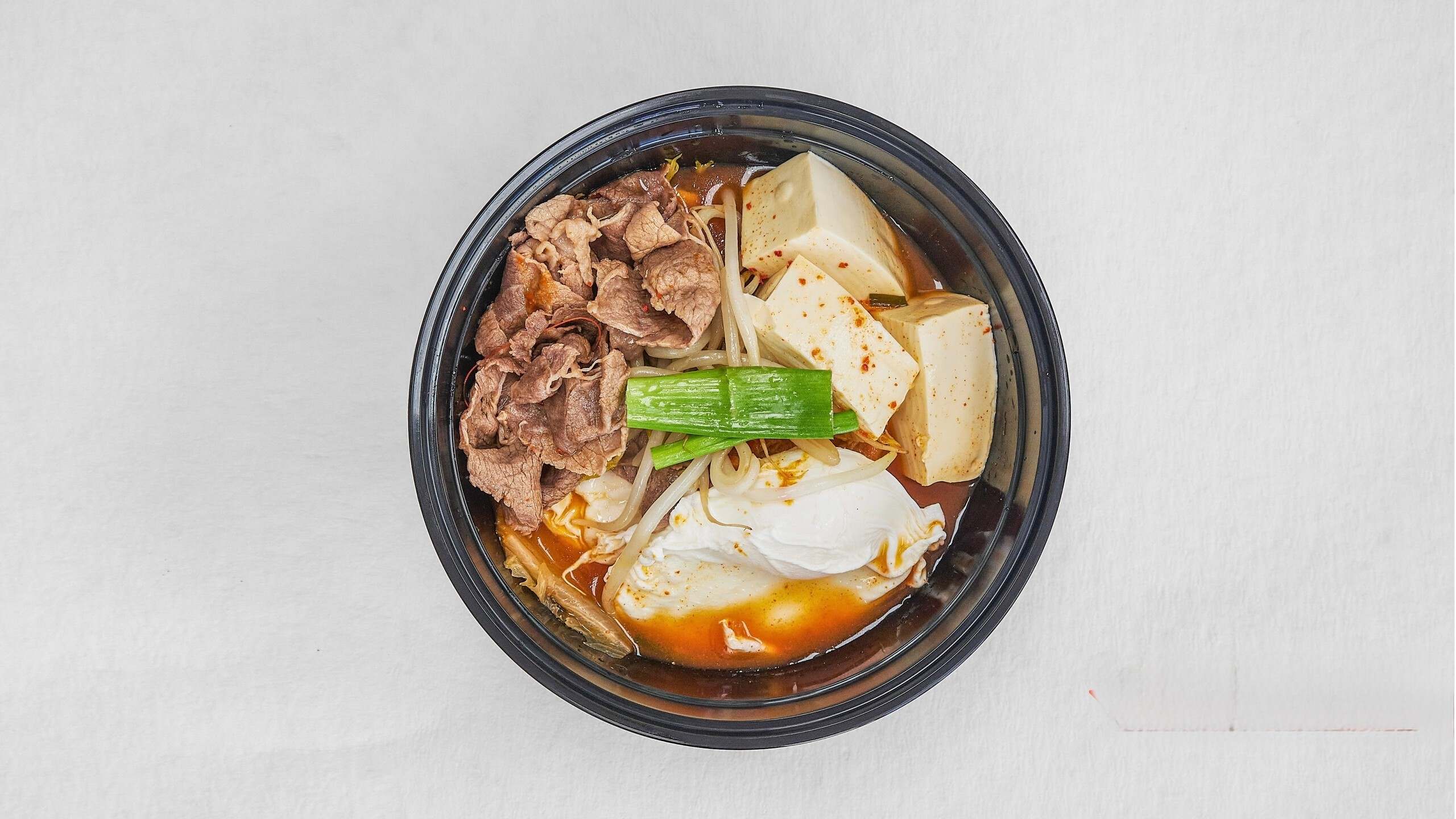 Beef & tofu stew with kimchi, spicy broth at Kimchi & Ramen Express Train,a Korean Restaurant in Cape Elizabeth