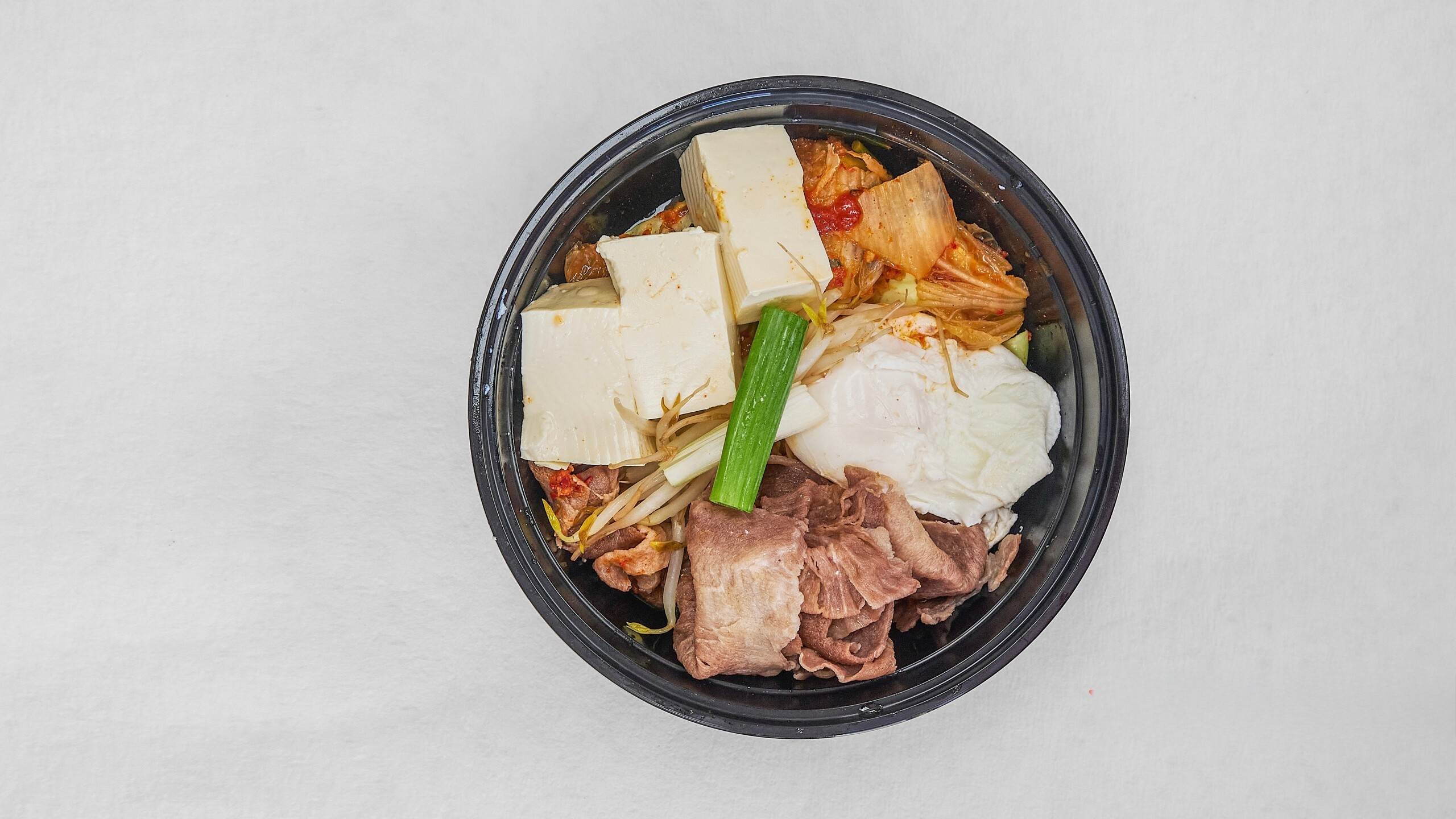 Pork tofu stew with kimchi, rich flavor at Kimchi & Ramen Express Train,a Korean Restaurant in Cape Elizabeth
