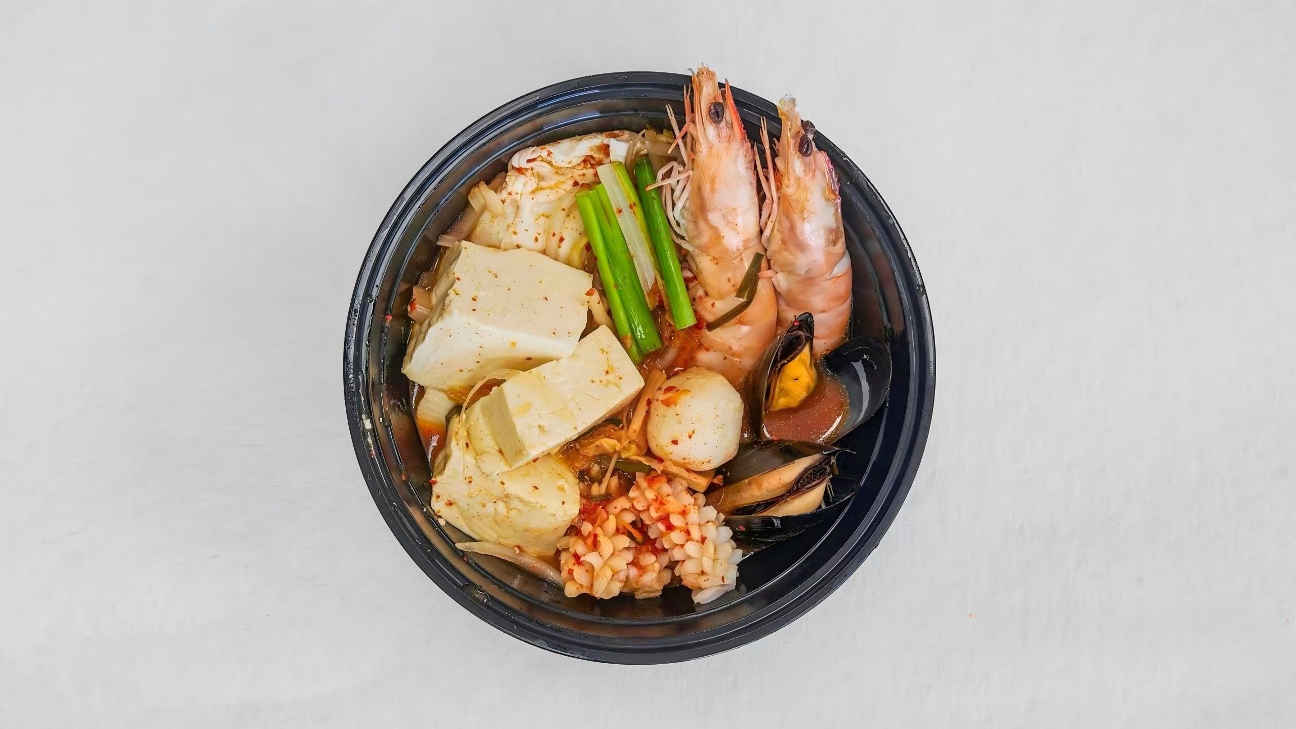 Seafood tofu soup with kimchi, fresh & spicy at Kimchi & Ramen Express Train,a Korean Restaurant in Cape Elizabeth