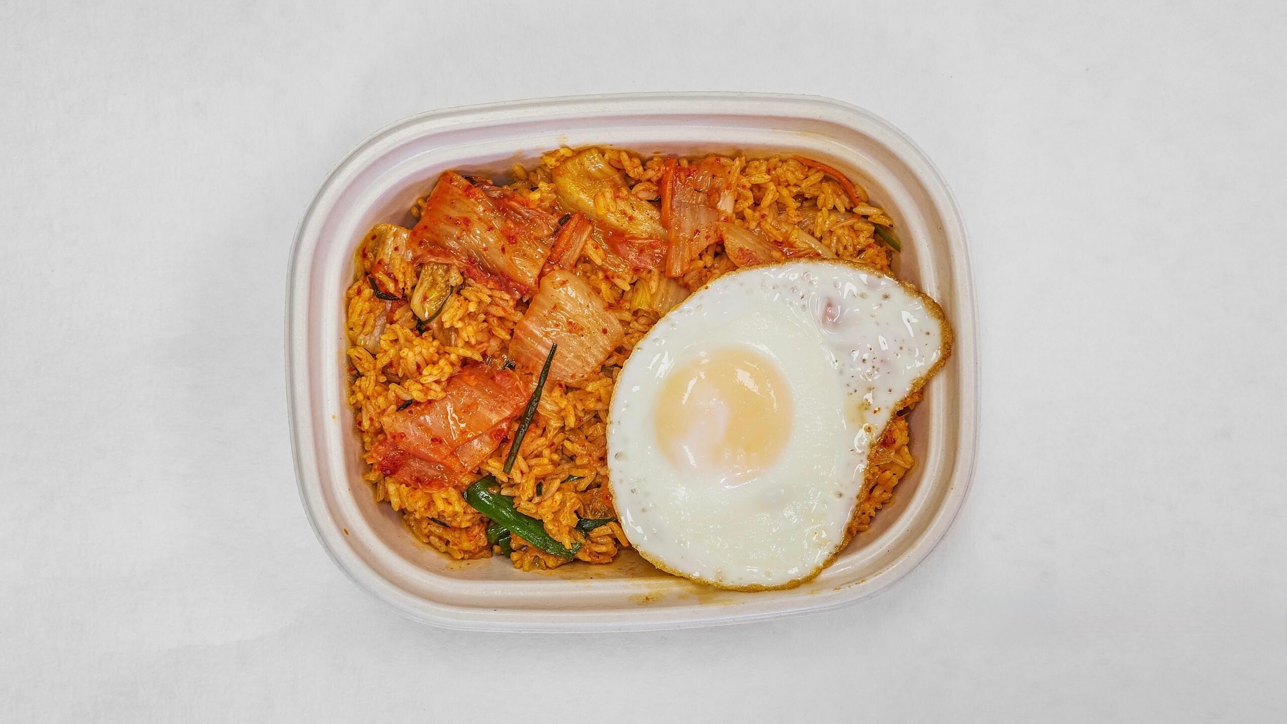 Kimchi fried rice topped with a fried egg at Kimchi & Ramen Express Train,a Korean Restaurant in Cape Elizabeth