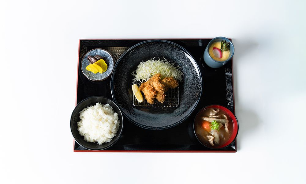 Japanese fried chicken set meal with rice and side dishes