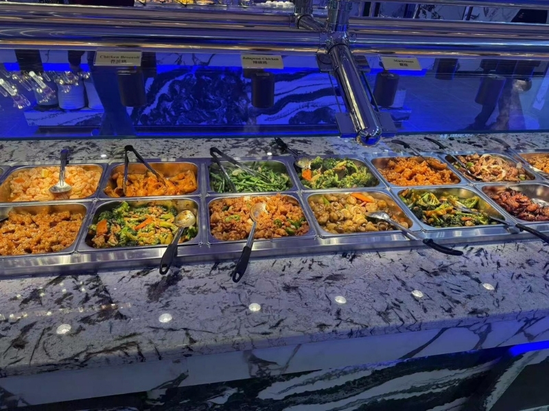 Chinese stir-fry station with shrimp, chicken, and vegetable dishes at King Buffet, a Buffet Restaurant in Westminster.