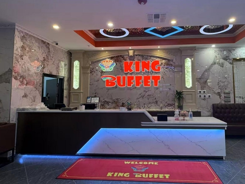 Spacious reception area with marble walls and neon sign at King Buffet, a Buffet Restaurant in Westminster.