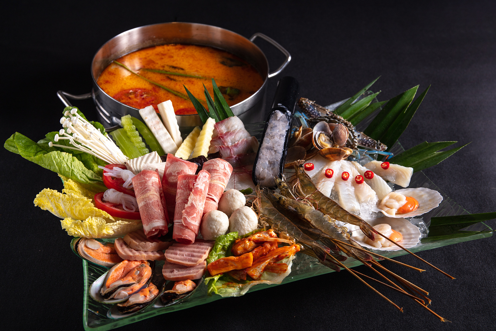 Variety of hot pot ingredients with a pot of soup at King Pot Korean BBQ & Hot Pot, a Asian Fusion restaurant in Greeley