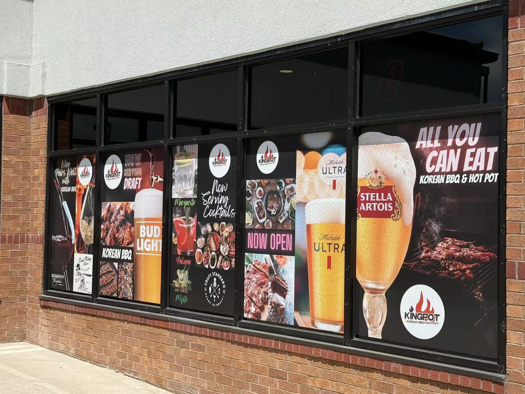 Window ads of Kingpot promoting food, drinks and “All You Can Eat” at King Pot Korean BBQ & Hot Pot, a Asian Fusion restaurant in Greeley