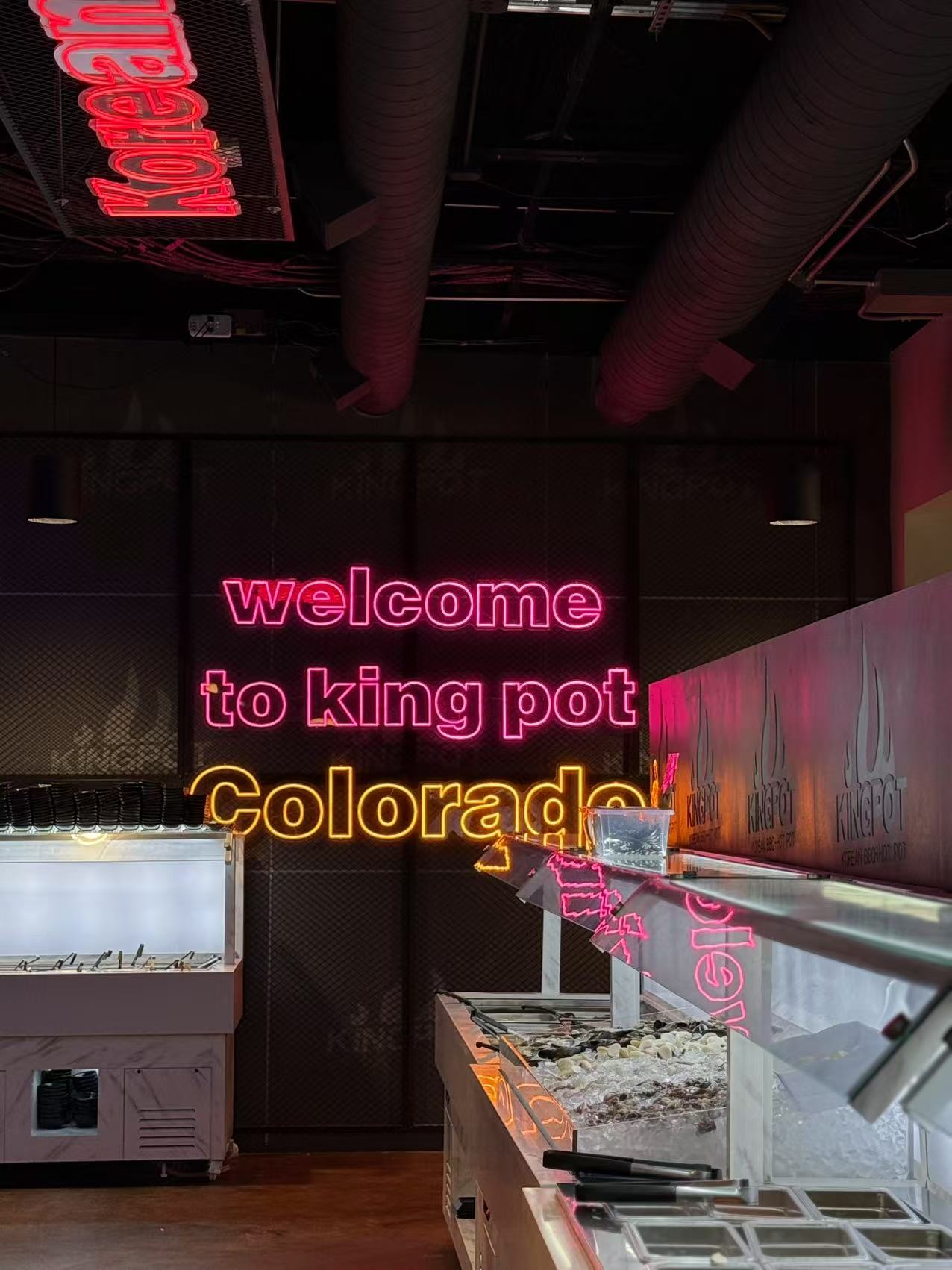 Neon sign in Kingpot saying “welcome to king pot Colorado” at King Pot Korean BBQ & Hot Pot, a Asian Fusion restaurant in Greeley