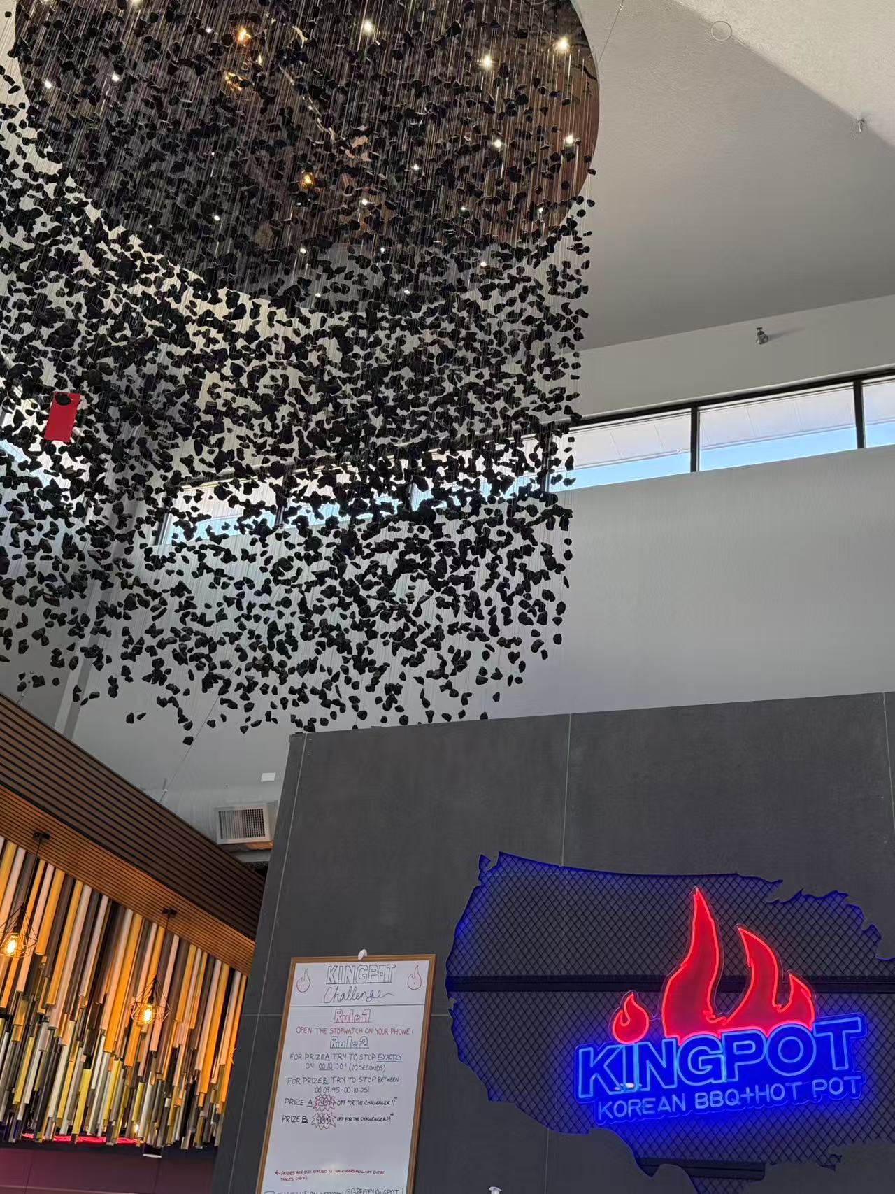 Lobby of Kingpot Korean BBQ & Hot Pot with chandelier and signage at King Pot Korean BBQ & Hot Pot, a Asian Fusion restaurant in Greeley