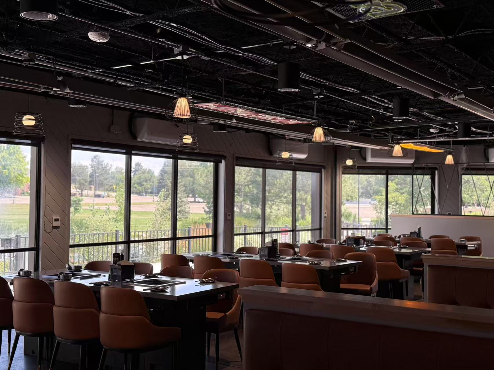 Spacious dining area of Kingpot with large windows and tables