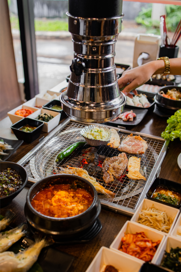 Korean charcoal BBQ with seafood, meat and side dishes