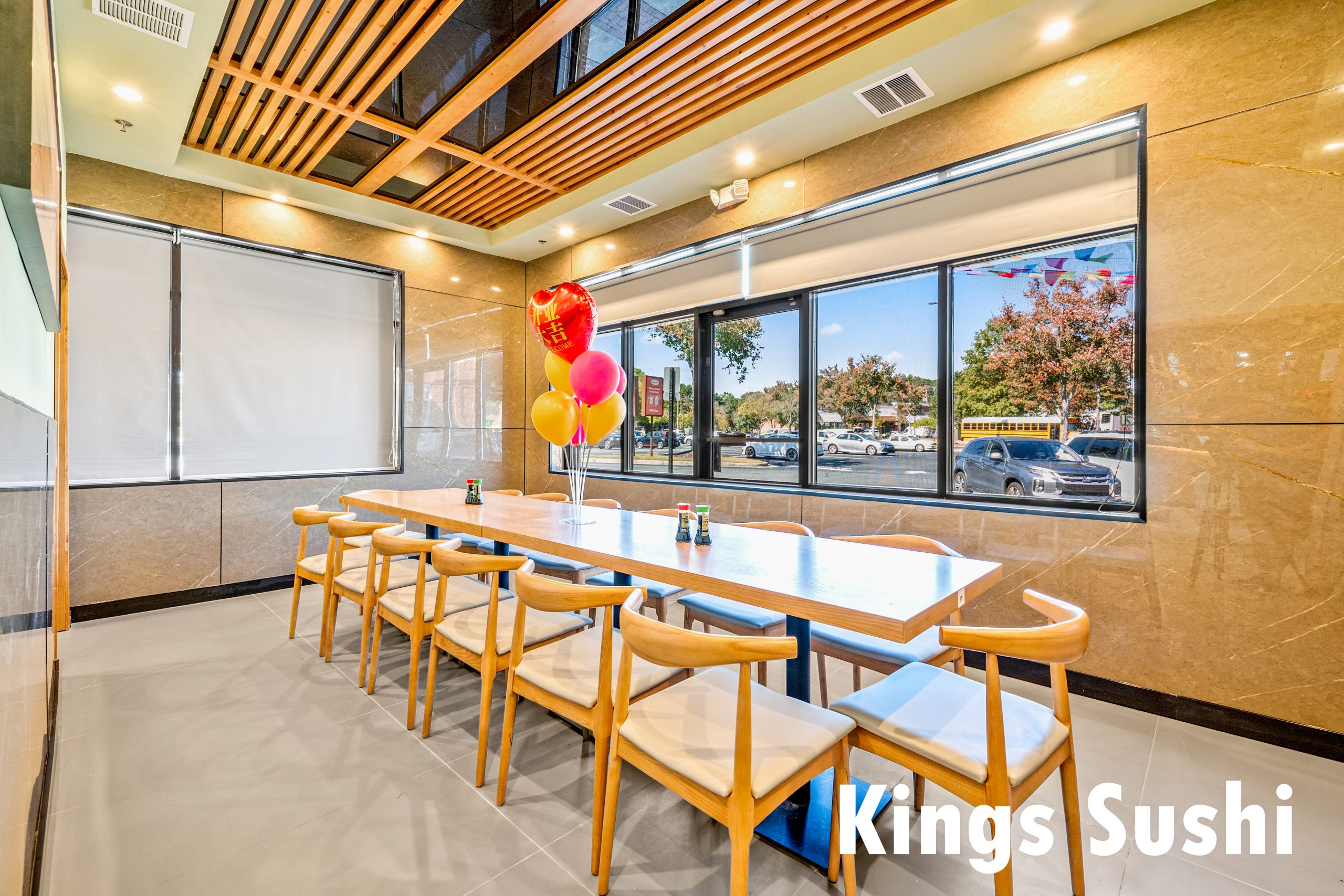 Window-side long table seating at Kings Sushi, a Japanese Restaurant in Buford