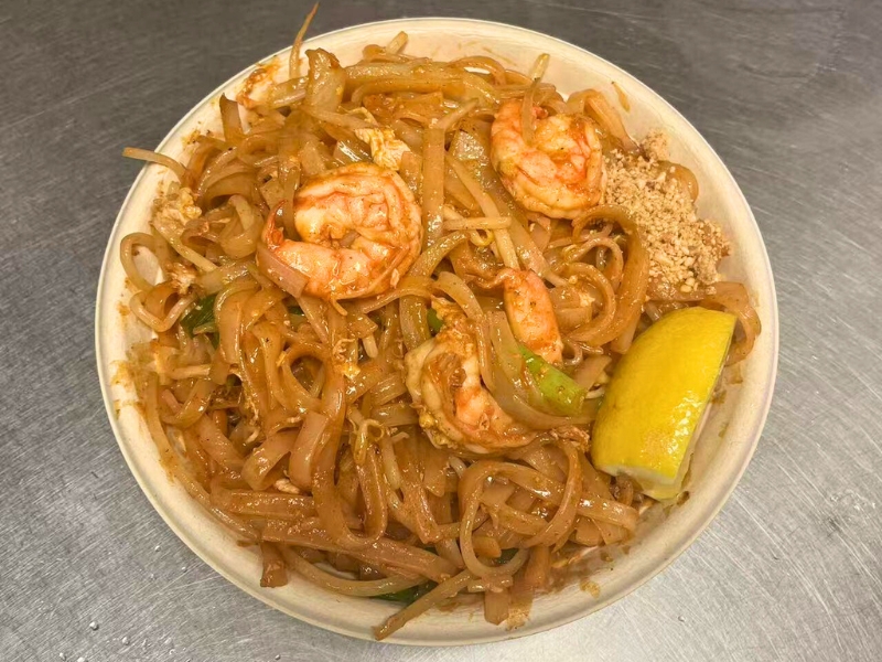 Thai-style rice noodles with shrimp, peanuts & a lemon wedge at King Wok, a Chinese Restaurant in Powdersville.