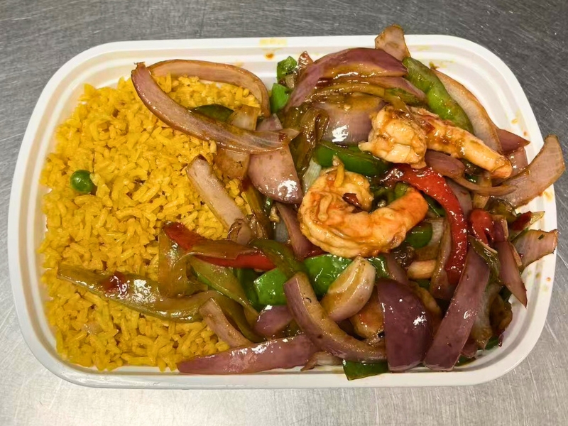 Spicy stir-fried shrimp with onions & peppers, served with yellow rice at King Wok, a Chinese Restaurant in Powdersville.