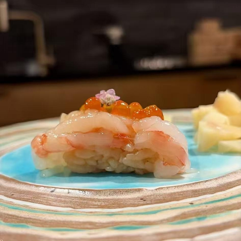 Sweet Botan ebi nigiri topped with ikura at Ki Omakase, a Sushi Restaurant in Little Neck