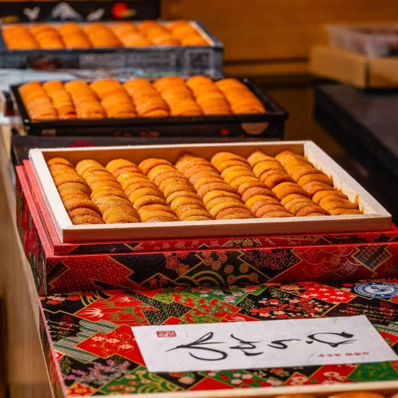 Boxes of plump premium sea urchin at Ki Omakase, a Sushi Restaurant in Little Neck