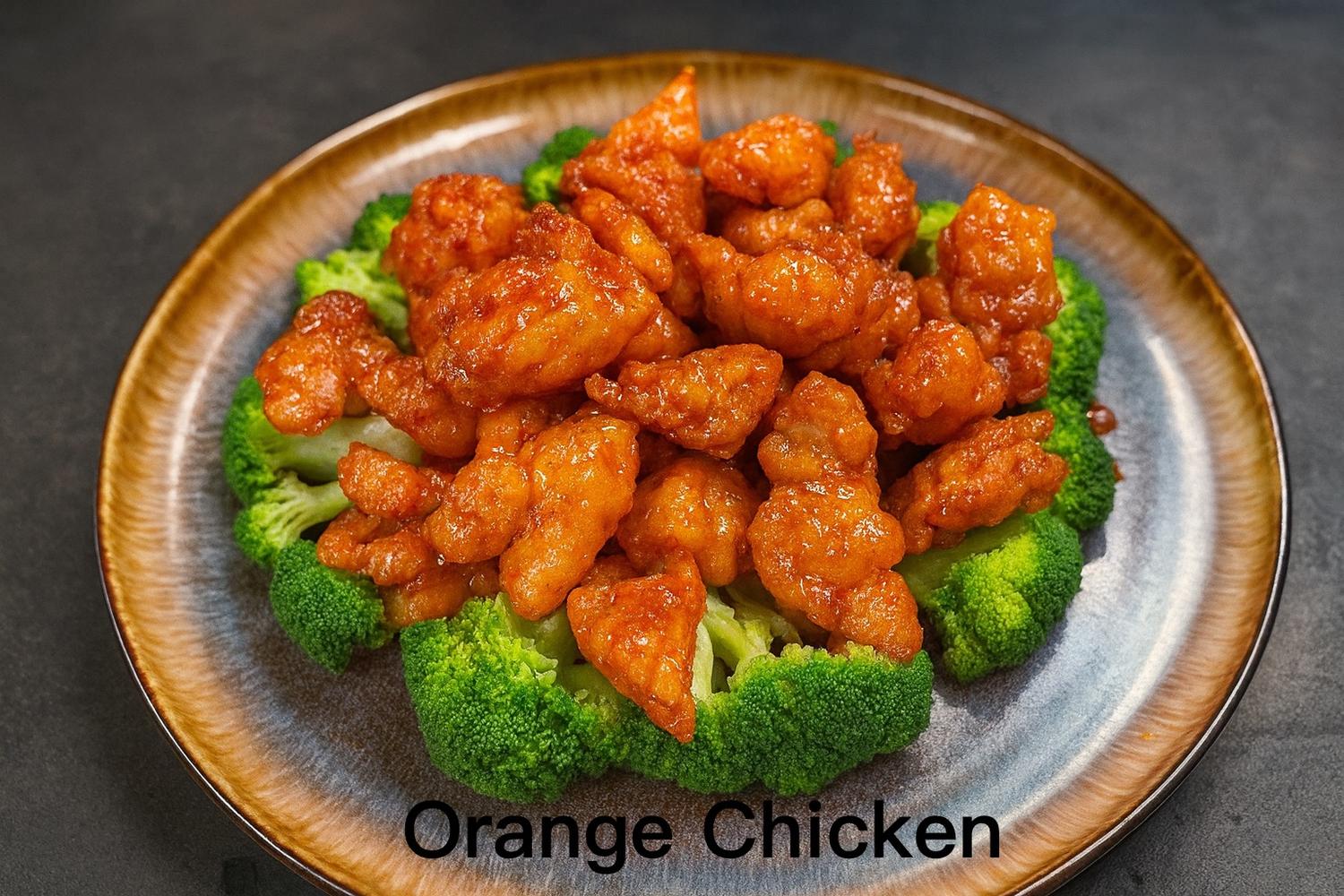 Sweet tangy orange chicken served over steamed broccoli florets at Kirin Asian Fusion Restaurant in Sioux City