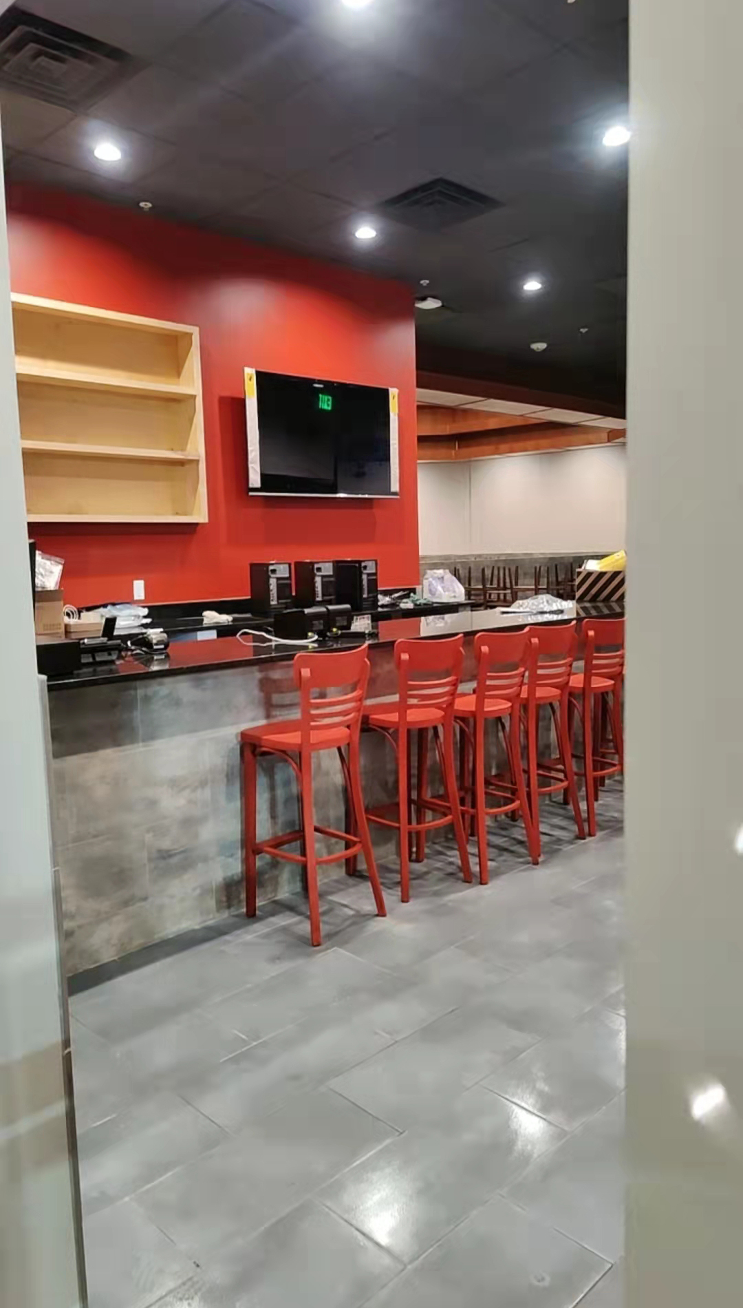 Red bar stools at the counter at Kirin Hot Pot, a Chinese Restaurant in Broomfield