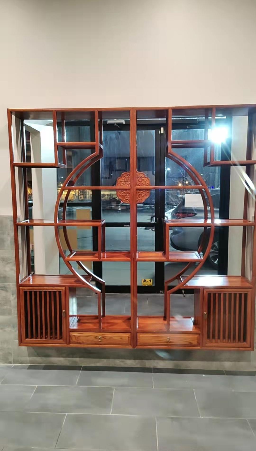 Wooden display shelf by the entrance at Kirin Hot Pot, a Chinese Restaurant in Broomfield