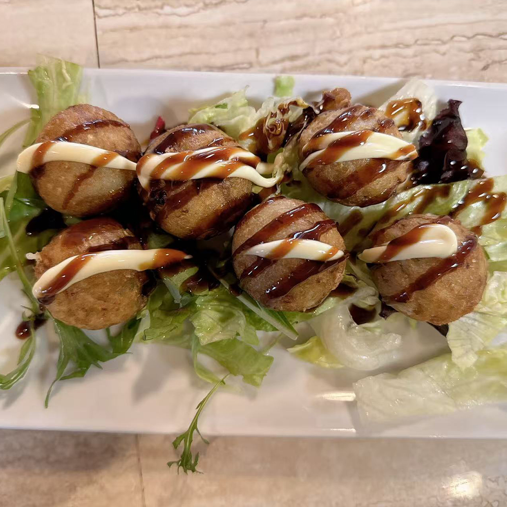 Takoyaki served fresh at a Japanese ramen, sushi, and Asian cuisine restaurant in Yukon.