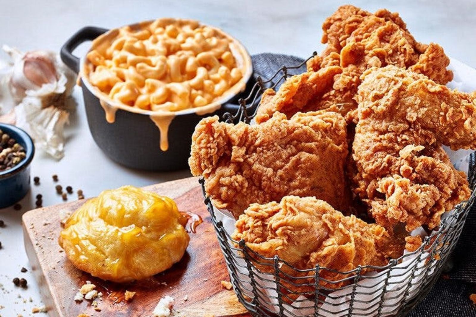 Crispy fried chicken paired with creamy mac and cheese and a biscuit at Krispy Krunchy Chicken - Halal, a Fast - Food in Richardson