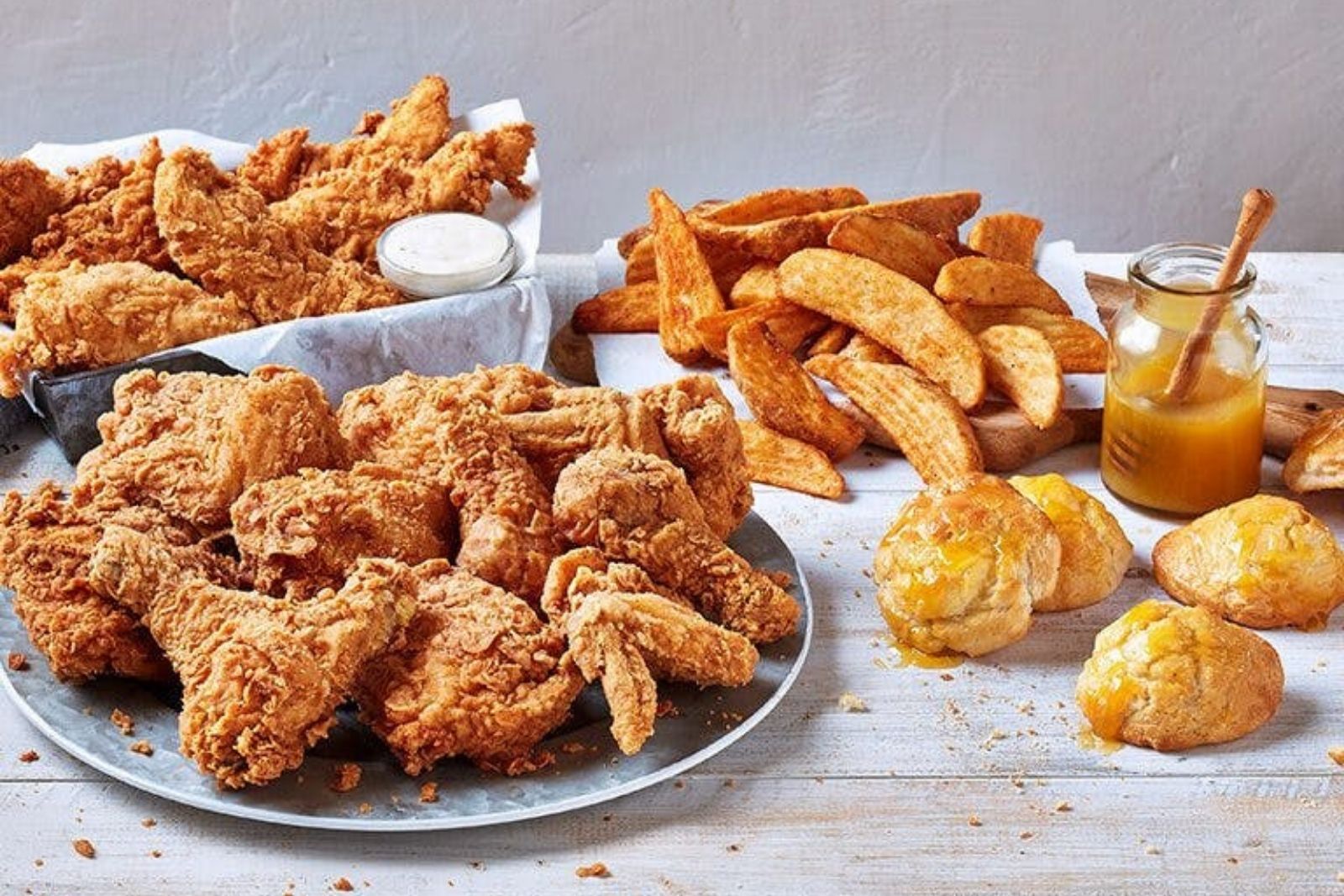 Generous fried chicken pack with fries, biscuits and sauce at Krispy Krunchy Chicken - Halal, a Fast - Food in Richardson