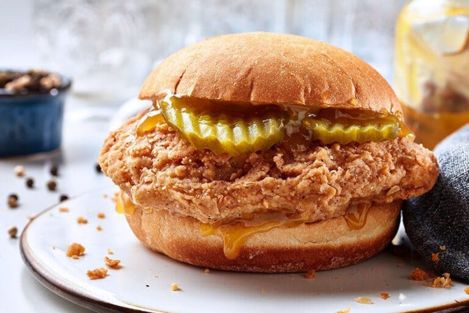 Crispy chicken sandwich with pickles and honey sauce at Krispy Krunchy Chicken - Halal, a Fast - Food in Richardson