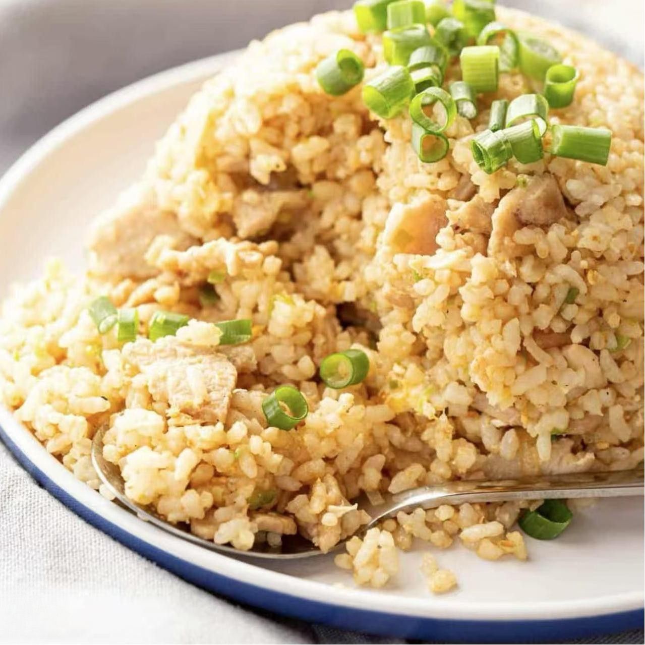 Chicken Fried Rice - Flavorful fried rice with chicken and green onions at Koi Ramen & Sushi, a Japanese Restaurant in Grand Junction