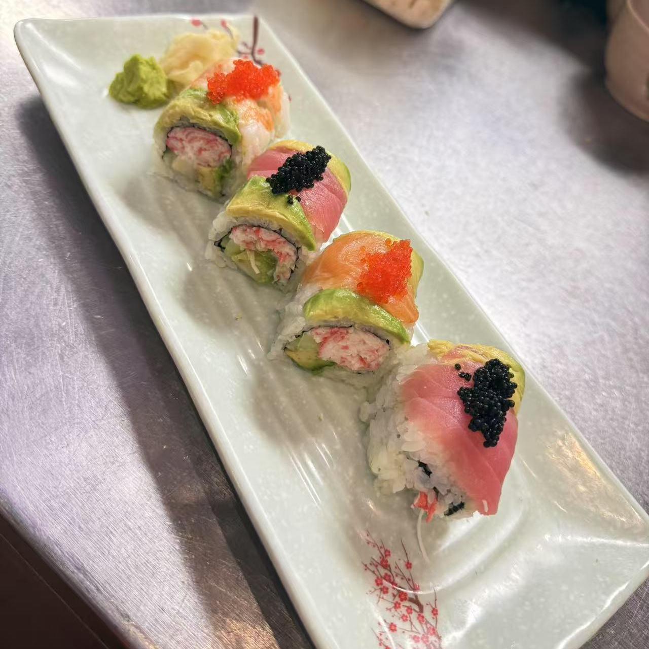 Specialty Sushi Rolls - Colorful sushi rolls topped with fish roe and avocado at Koi Ramen & Sushi, a Japanese Restaurant in Grand Junction
