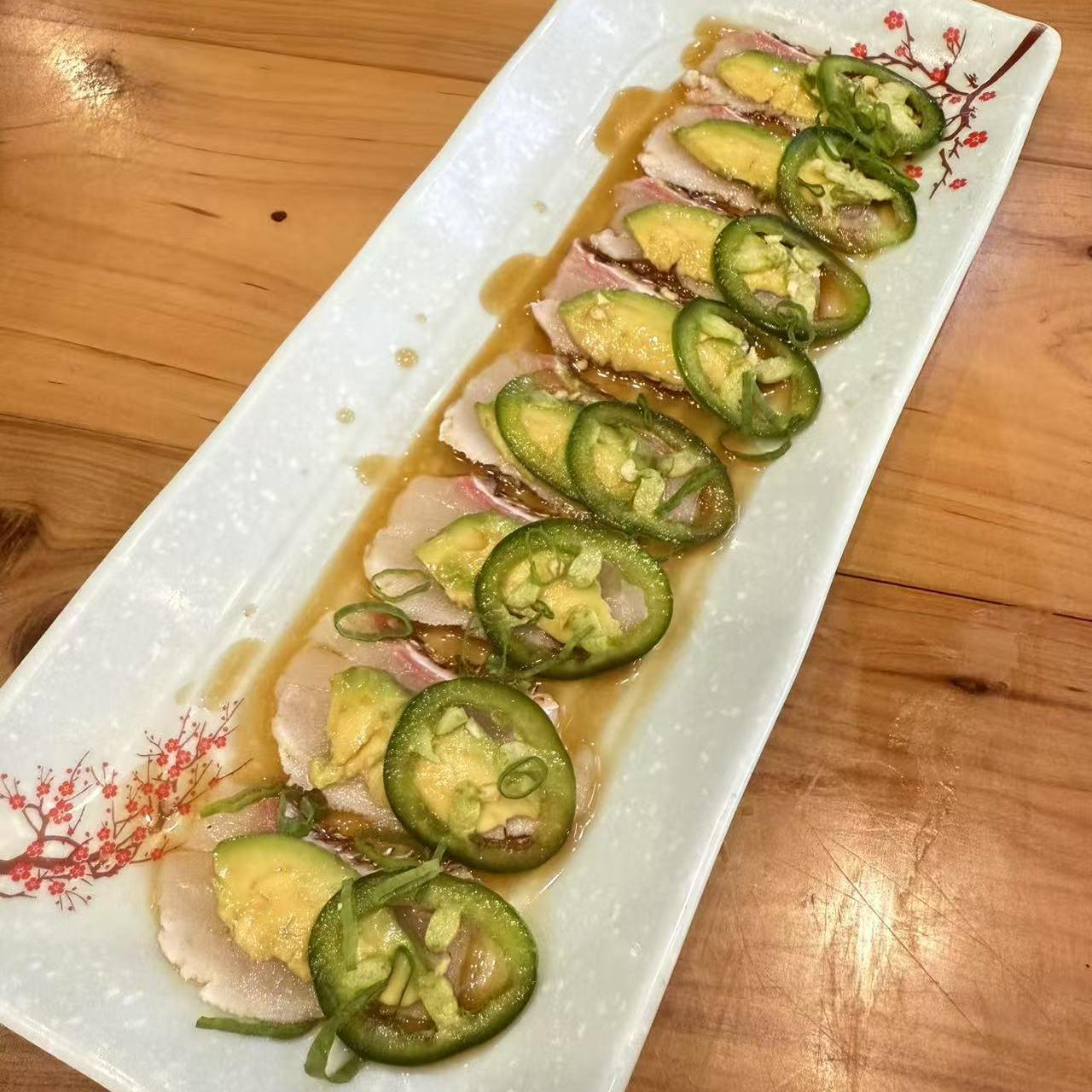 Tuna Avocado Sashimi - Tuna slices paired with avocado and jalapeno in sauce at Koi Ramen & Sushi, a Japanese Restaurant in Grand Junction