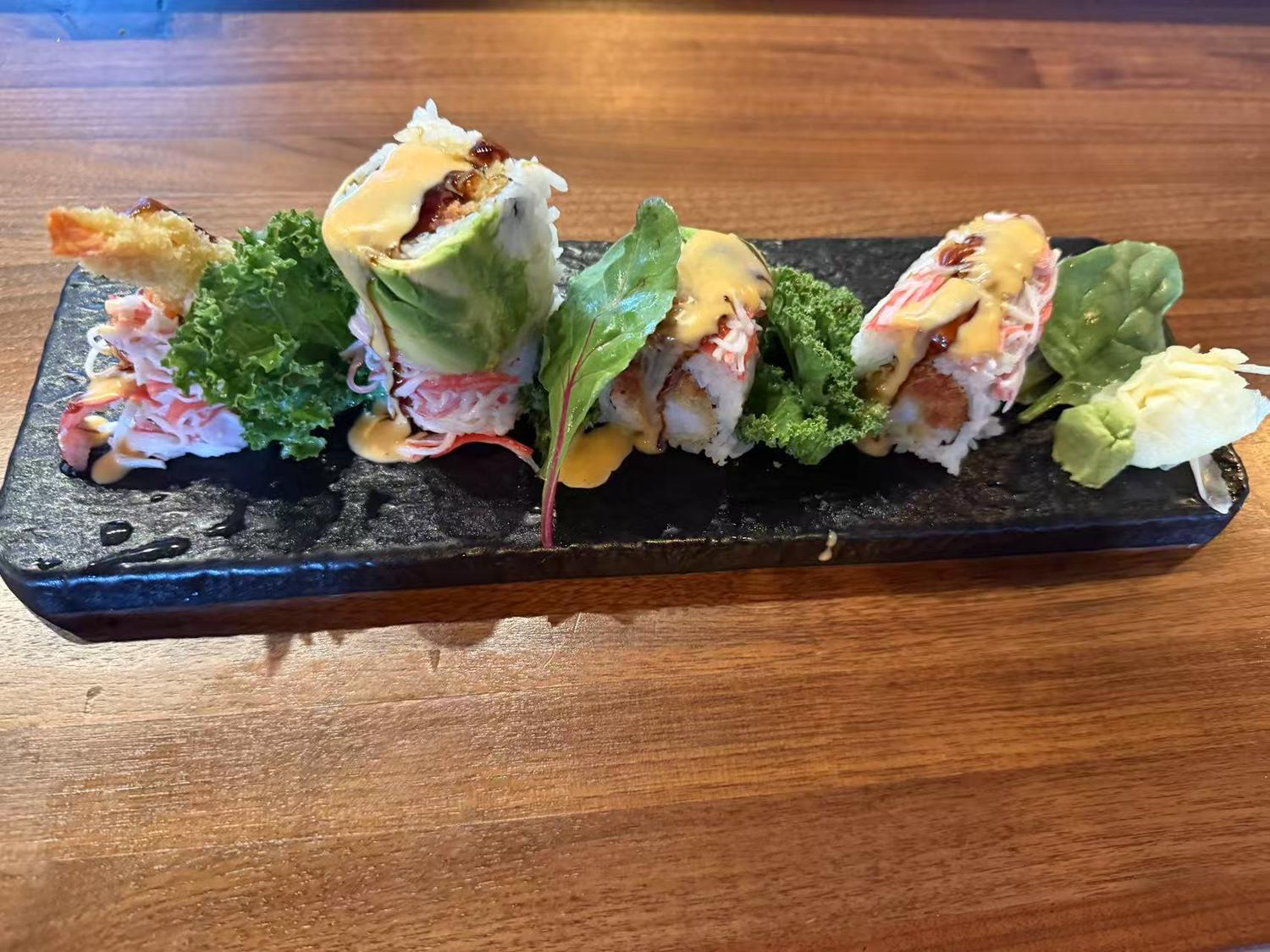 Special Sushi Roll - Assorted sushi rolls with sauces and garnishes at Koi Ramen&Sushi, a Japanese restaurant in Hutchinson