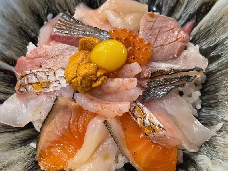 Luxury seafood donburi with uni, ikura & quail egg at Koi Sushi, a Japanese Restaurant in Gaithersburg