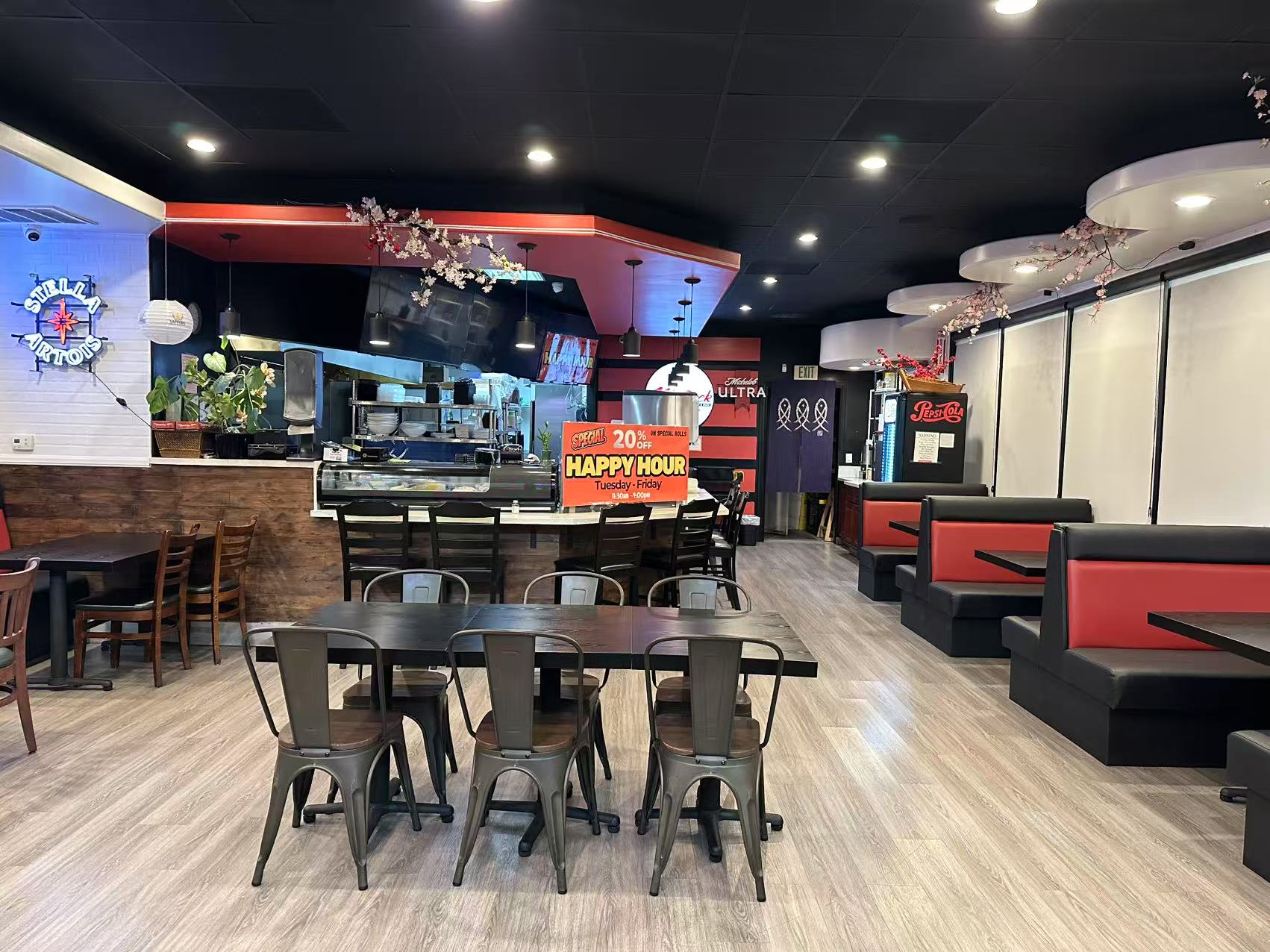 Restaurant Interior - Modern dining area with tables, booths and a sushi bar at Kokodeck Sushi, a Japanese restaurant in Anaheim