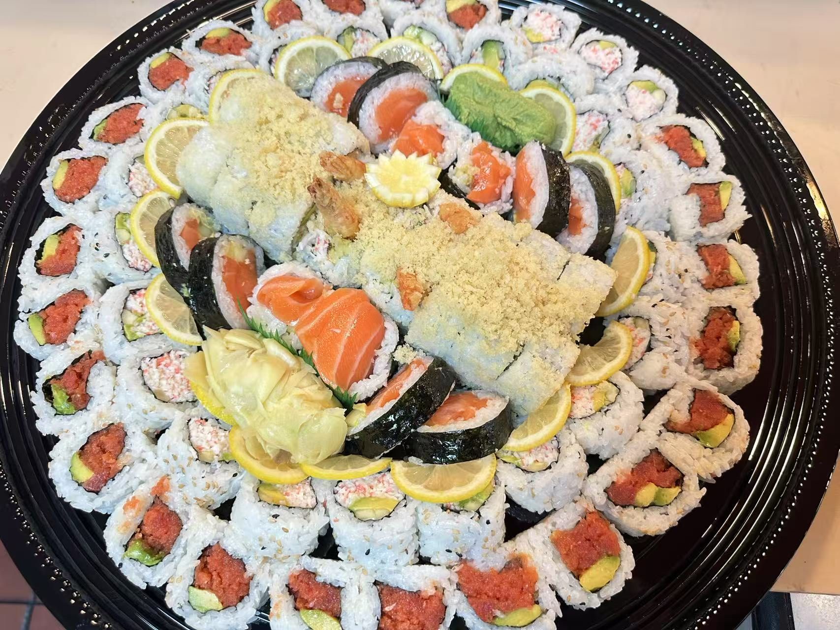 Classic Roll Platter - Assorted sushi rolls on a large platter at Kokodeck Sushi, a Japanese restaurant in Anaheim