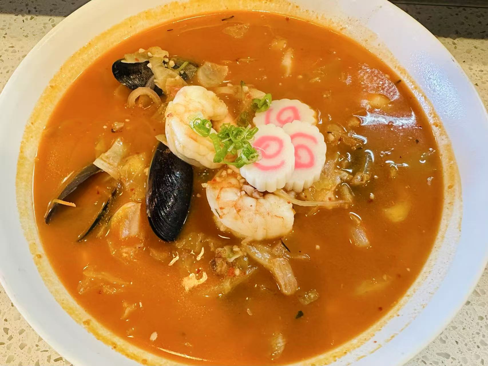 Spicy Seafood Ramen - Ramen with seafood in spicy broth at Kokodeck Sushi, a Japanese restaurant in Anaheim