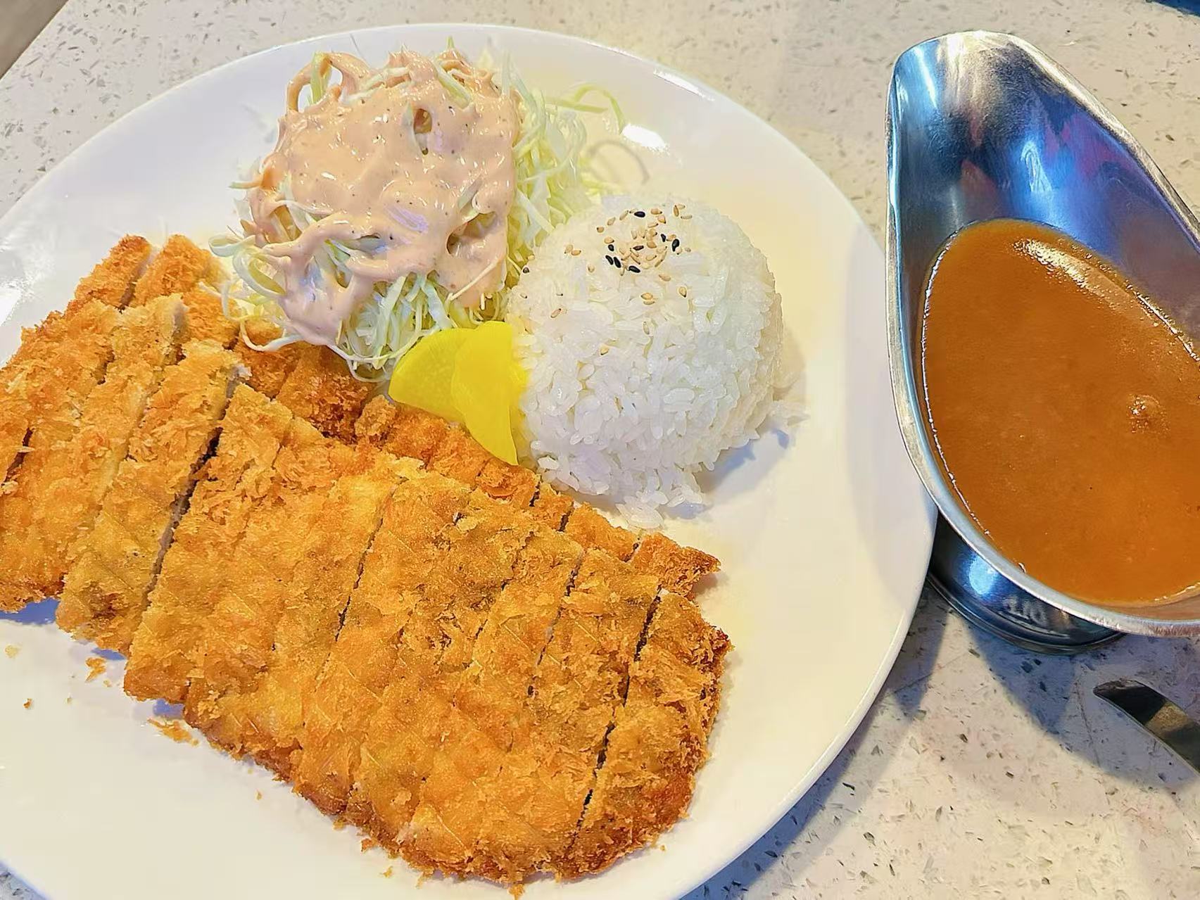 Tonkatsu - Breaded pork cutlet with rice, salad and sauce at Kokodeck Sushi, a Japanese restaurant in Anaheim