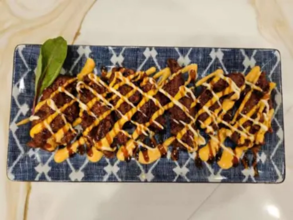 Grilled beef strips drizzled with dual sauces at KOKORO House Of Ramen, a Ramen Restaurant in Glen Rock