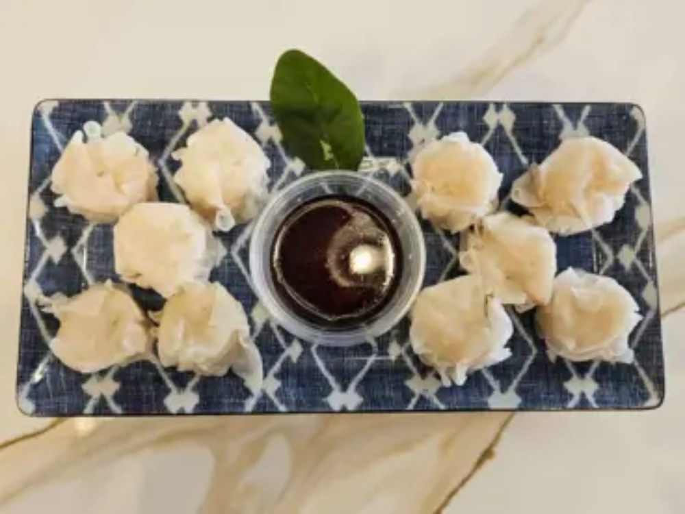 Steamed shrimp shumai with dipping sauce at KOKORO House Of Ramen, a Ramen Restaurant in Glen Rock