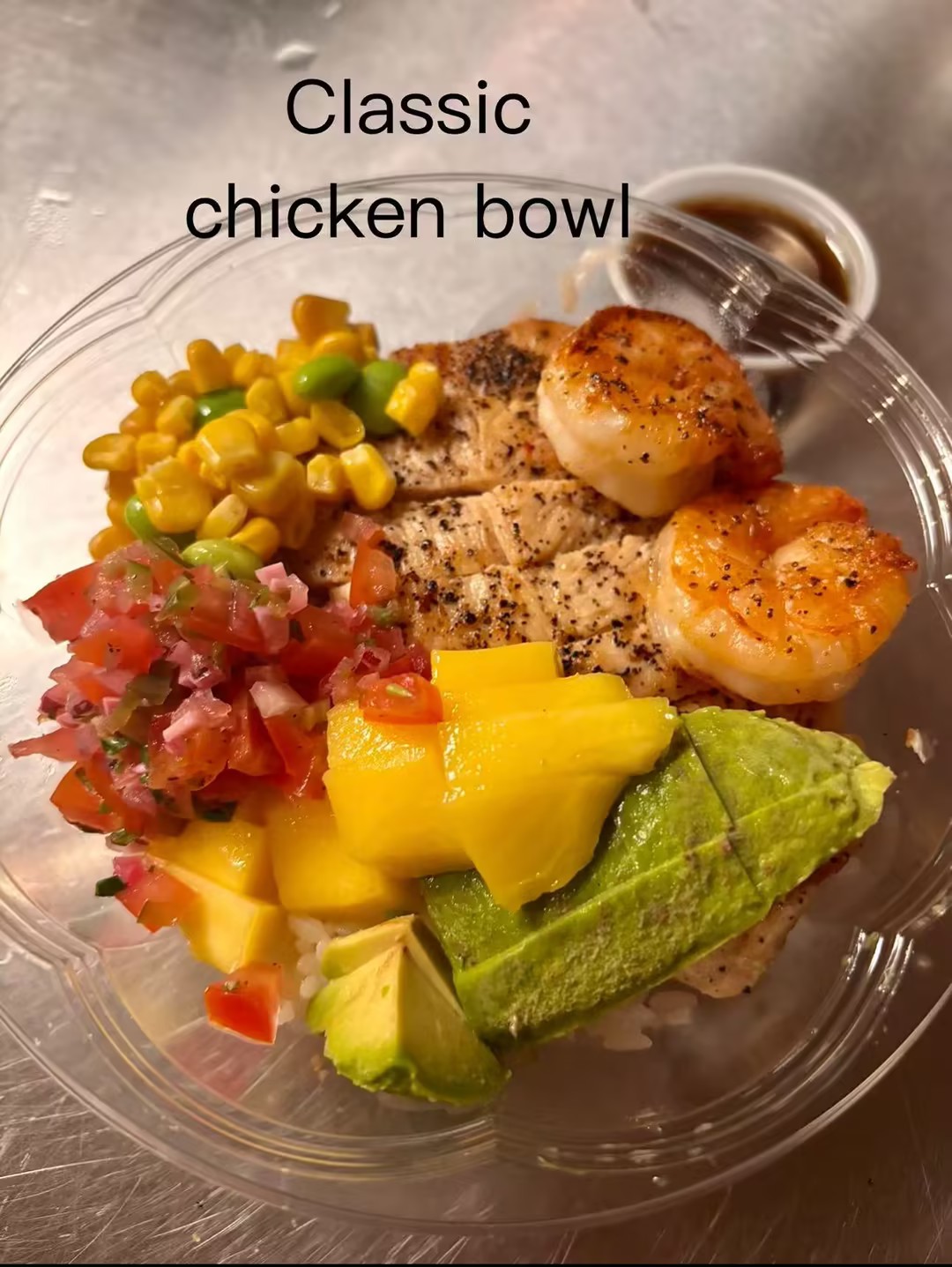 Bowl with grilled chicken, shrimp, mango, avocado and veggies at Komachi, a Asian Restaurant in Suffield