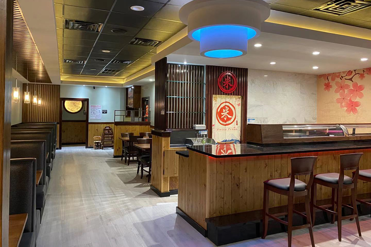 Spacious modern wooden themed japanese restaurant dining interior at Komeya Sushi & Ramen, a Japanese Restaurant in Spring