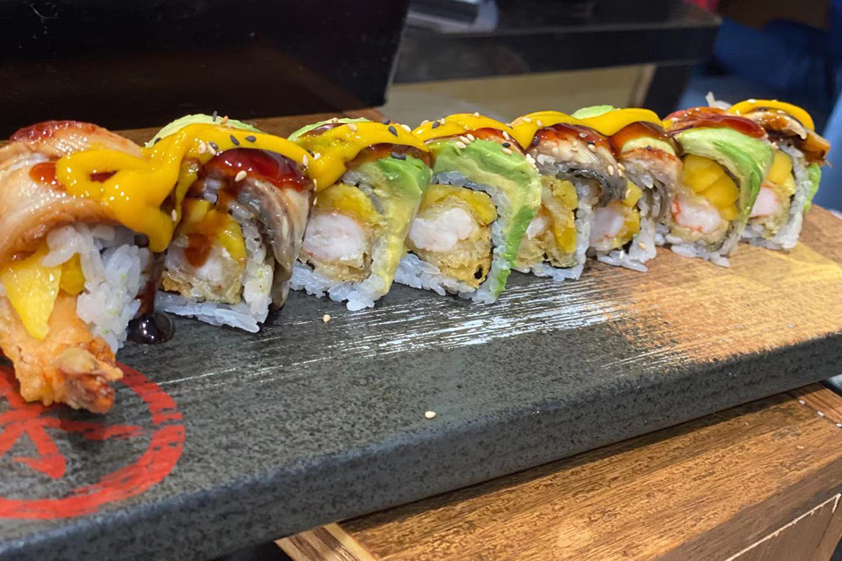 Mango eel tempura shrimp avocado fusion sushi roll at Komeya Sushi & Ramen, a Japanese Restaurant in Spring