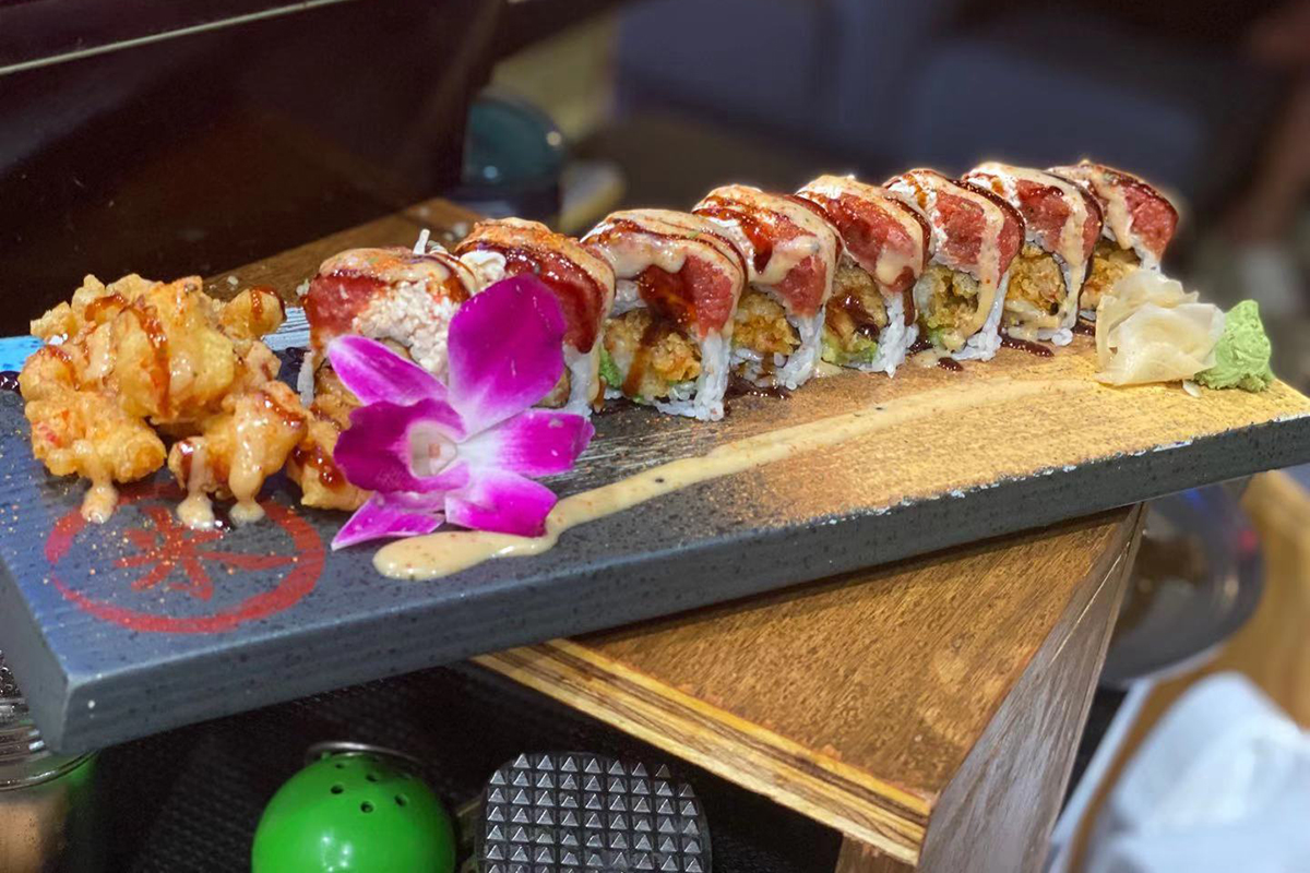 Seared tuna tempura shrimp decorated gourmet sushi roll at Komeya Sushi & Ramen, a Japanese Restaurant in Spring