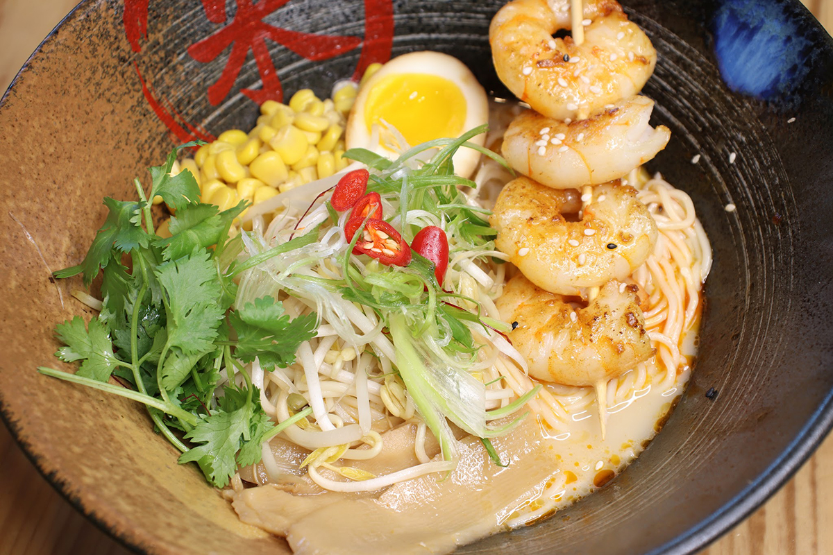 Savory grilled shrimp ramen skewer with corn cilantro and soft boiled egg at Komeya Sushi & Ramen, a Japanese Restaurant in Spring