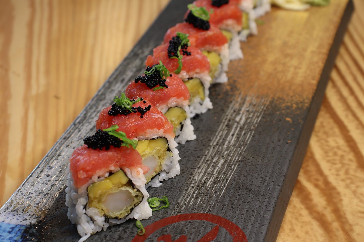Mango tempura shrimp sushi roll topped with raw tuna and black caviar at Komeya Sushi & Ramen, a Japanese Restaurant in Spring
