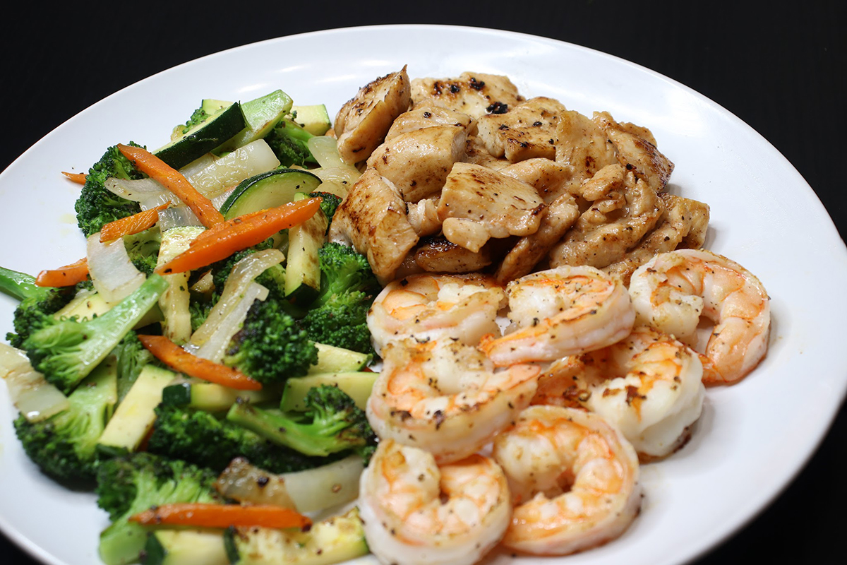 Grilled chicken and shrimp combo with fresh vegetable medley at Komeya Sushi & Ramen, a Japanese Restaurant in Spring
