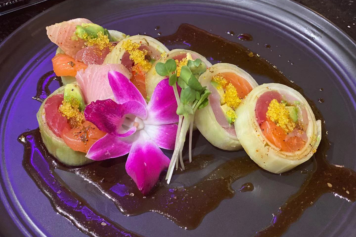 Cucumber wrapped mixed fresh fish sashimi flower plate at Komeya Sushi & Ramen, a Japanese Restaurant in Spring