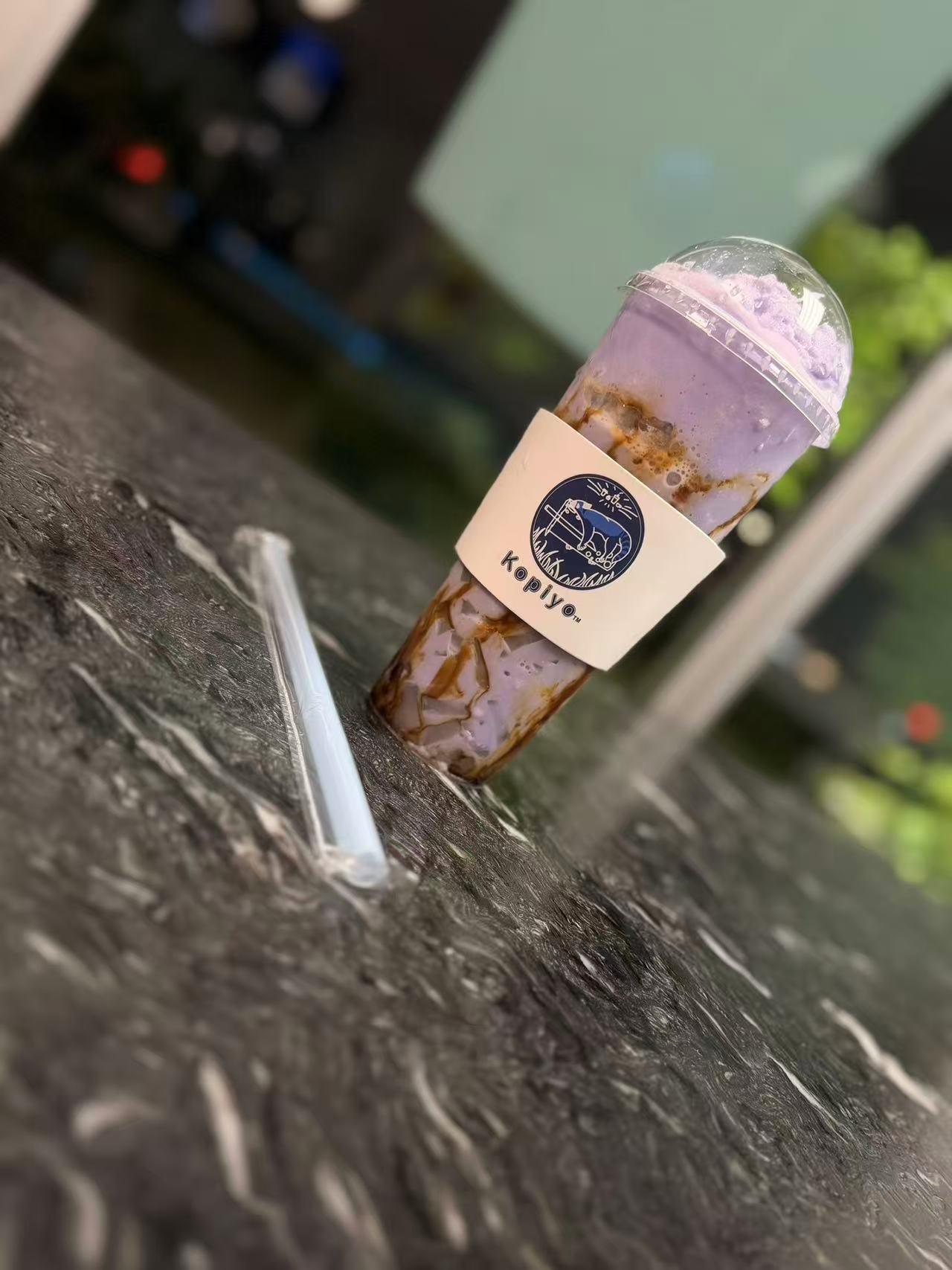 Purple taro slush drink with caramel swirl in a Kopiyo cup at Kopiyo, a Coffee shop in Flowood
