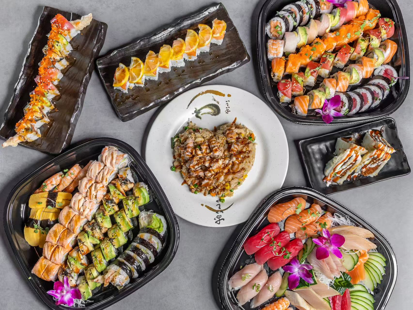 An assortment of sushi rolls, sashimi, and a heart-shaped rice dish at Koya Sushi, a Sushi Restaurant in Norco