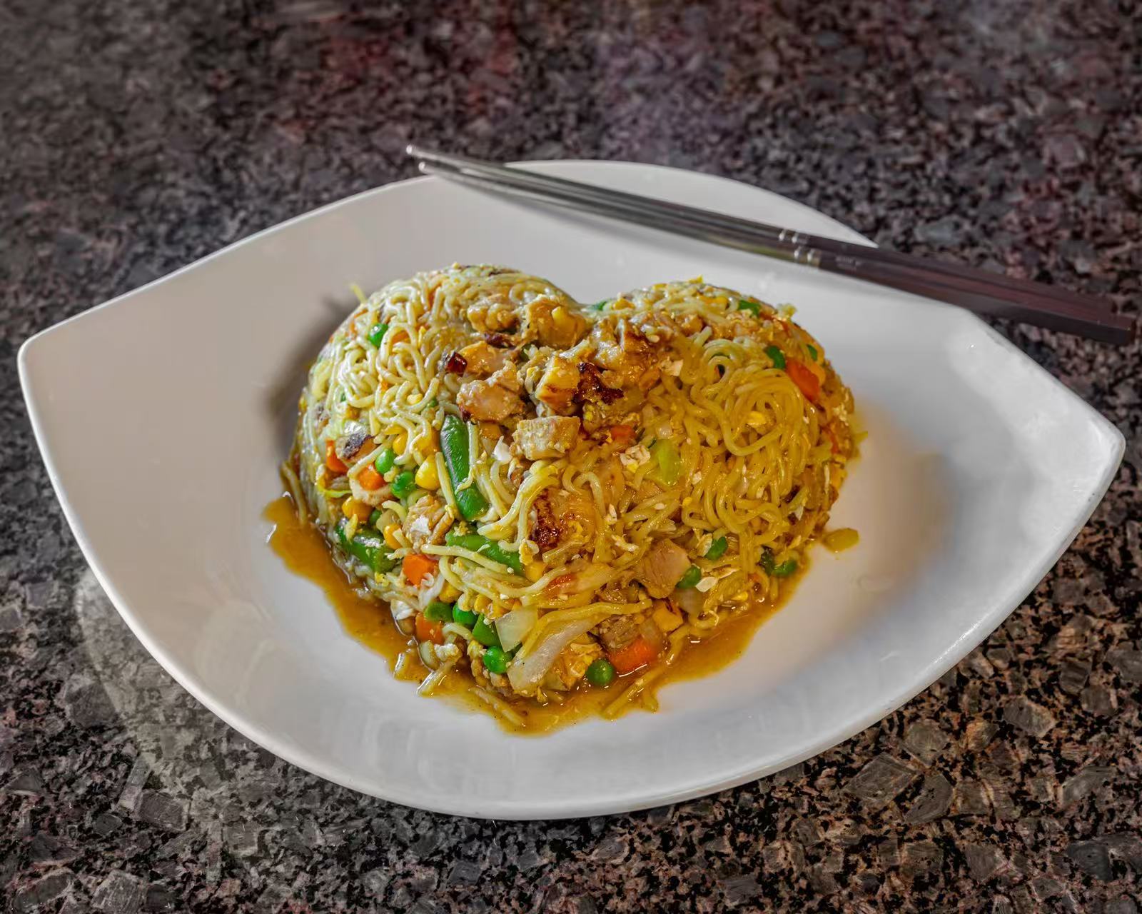 Heart-shaped chicken yakisoba with mixed vegetables and savory sauce at Koya Sushi, a Sushi Restaurant in Norco