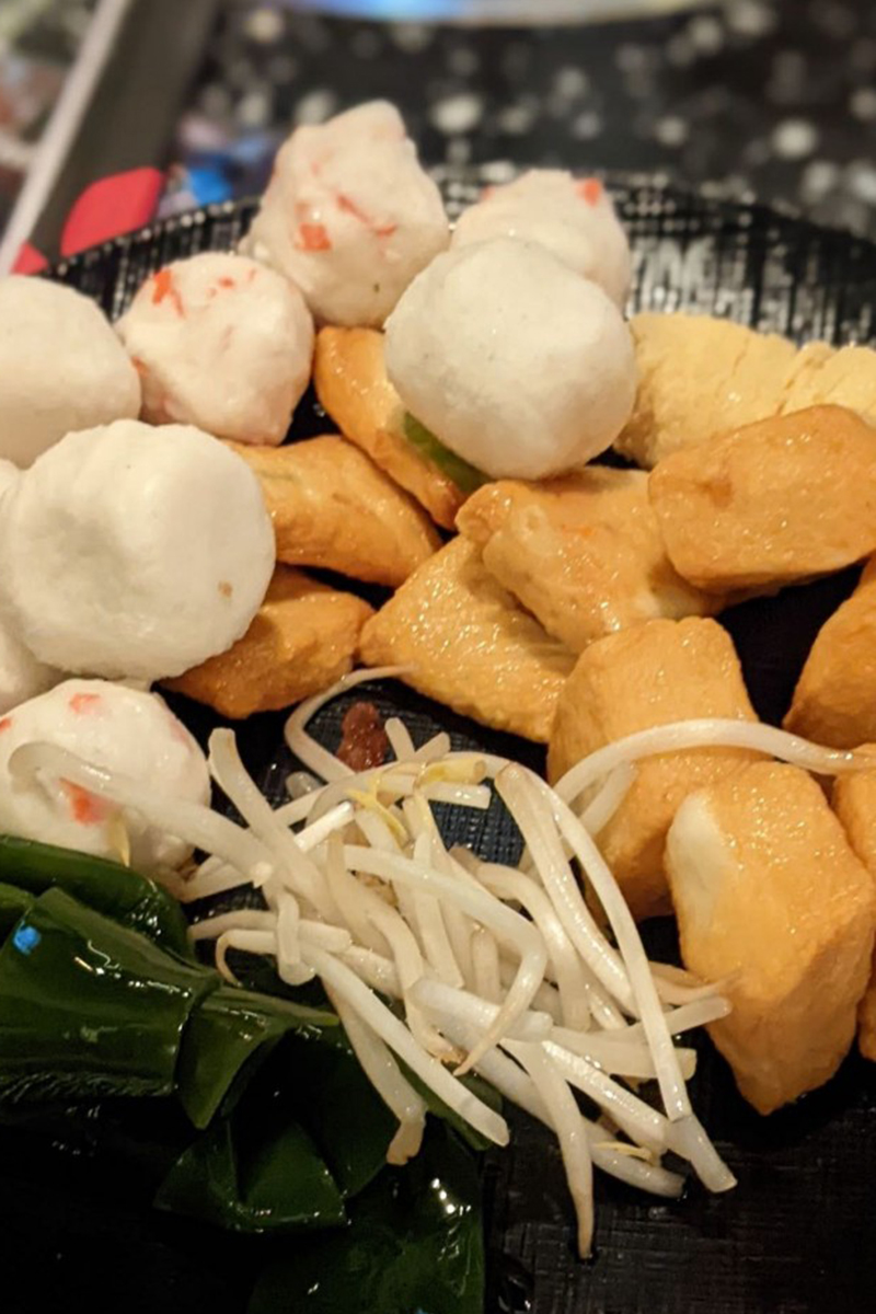 There are various ingredients in the plate, including meatballs and vegetables at K-Town Korean BBQ & Hotpot, a Korean BBQ & Hotpot Restaurant in Fort Wayne