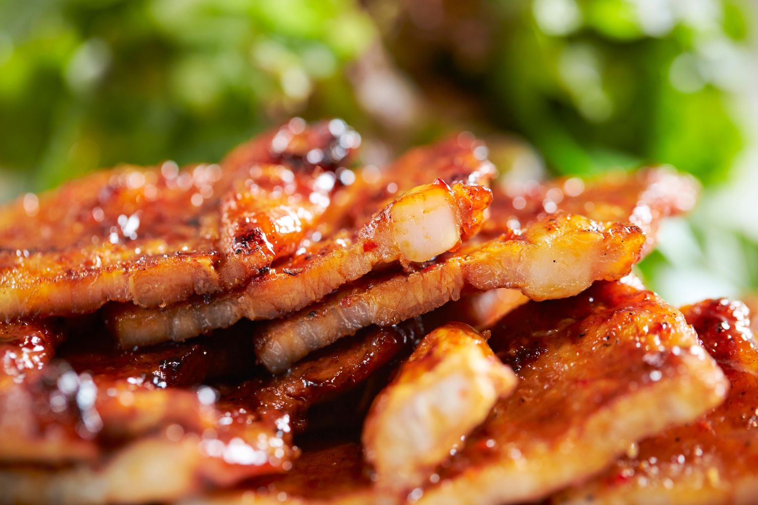 Grilled marinated pork belly slices with savory sauce at K-town Korean BBQ Restaurant in Hemet