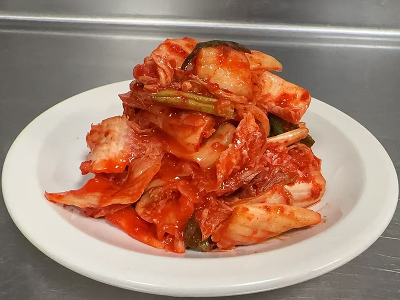 Spicy fermented cabbage side dish at Kublai Khan Crazy Mongolian Stir Fry & Sushi Bar, a Asian Restaurant in Austin